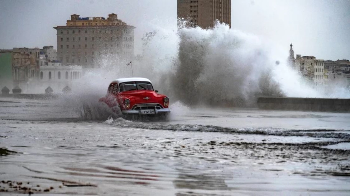 Huge waves and high winds hurl jellyfish and seaweed into the streets of Havana