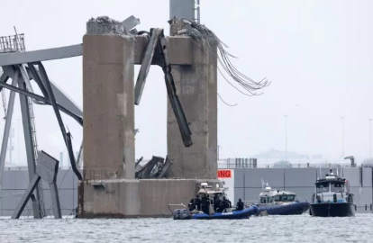US officials board ship that hit Baltimore bridge, divers search for bodies