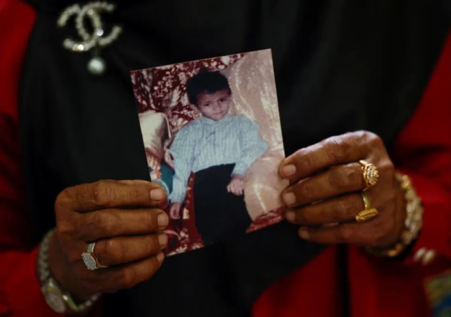 Indonesian tsunami survivor holds on to hope for missing son after 20 years