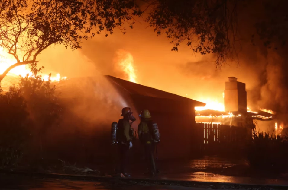 Los Angeles wildfires rage as strong winds put millions on alert