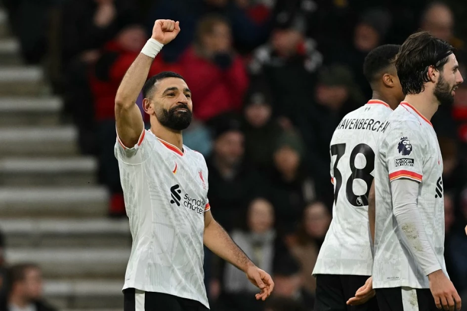 Salah's controversial penalty fires Liverpool nine points clear