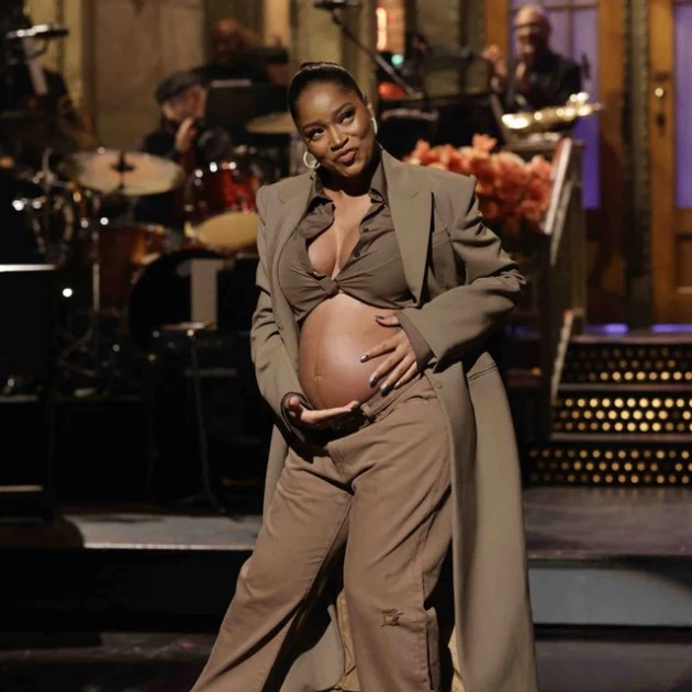 Keke Palmer reveals baby bump as part of her Saturday Night Live opening monologue