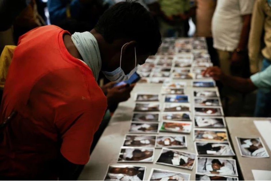 Families, rescuers search for victims of India's worst train crash in decades