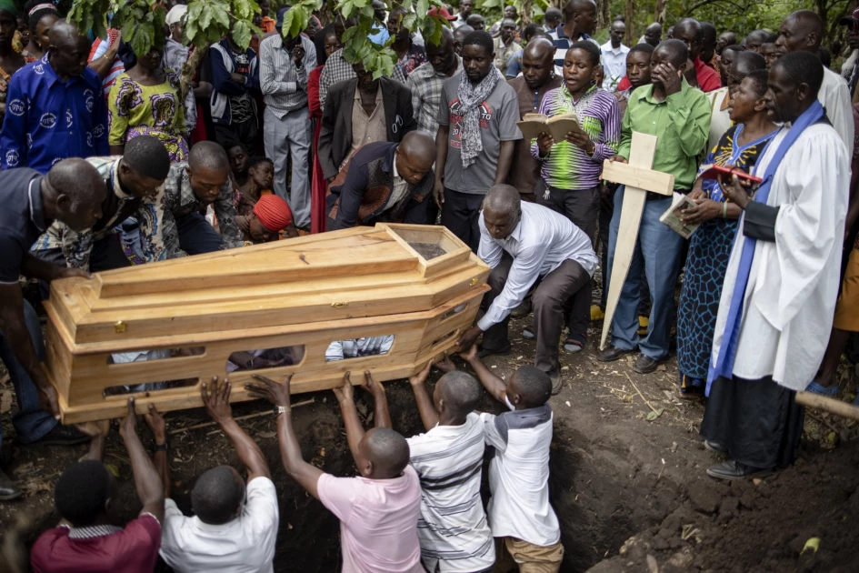 Ugandans bury more victims of horrific school massacre